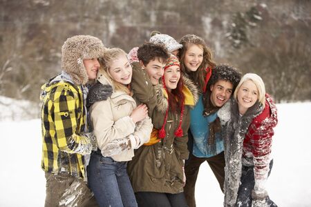 Group Of Teenage Friends Having Fun In Snowy Landscapeの写真素材