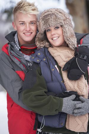 Romantic Teenage Couple In Snowの写真素材