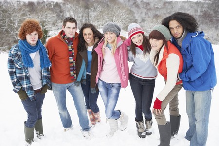Group Of Teenage Friends Having Fun In Snowy Landscapeの写真素材