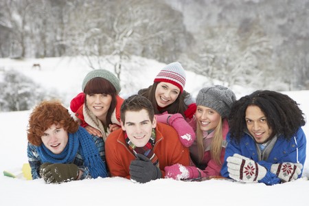 Group Of Teenage Friends Having Fun In Snowy Landscapeの写真素材