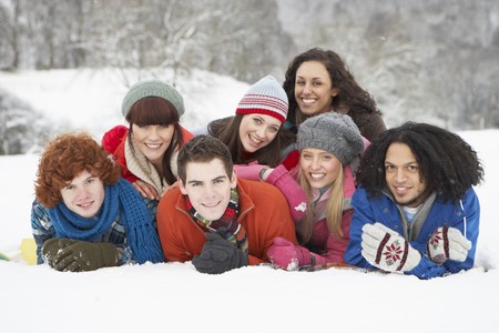 Group Of Teenage Friends Having Fun In Snowy Landscapeの写真素材