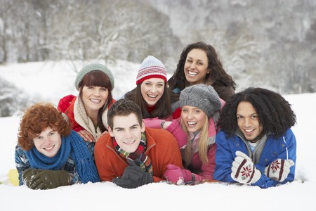 Group Of Teenage Friends Having Fun In Snowy Landscapeの写真素材