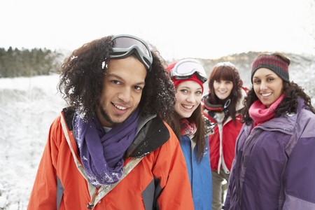 Group Of Teenage Friends Having Fun In Snowy Landscape Wearing Ski Clothingの写真素材