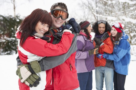 Group Of Teenage Friends Having Fun In Snowy Landscape Wearing Ski Clothingの写真素材