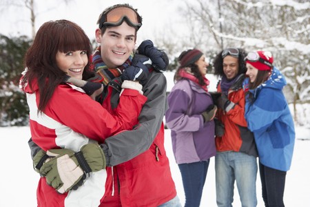 Group Of Teenage Friends Having Fun In Snowy Landscape Wearing Ski Clothingの写真素材