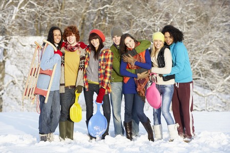 Group Of Teenage Friends Having Fun In Snowy Landscapeの写真素材