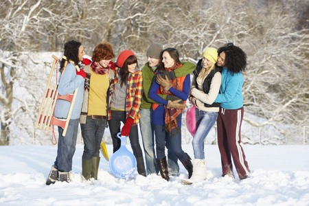 Group Of Teenage Friends Having Fun In Snowy Landscapeの写真素材