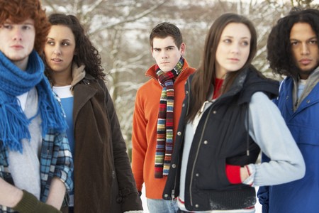 Group Of Teenage Friends Having Fun In Snowy Landscape Wearing Ski Clothingの写真素材