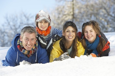 Young Family Having Fun In Snowy Landscapeの写真素材