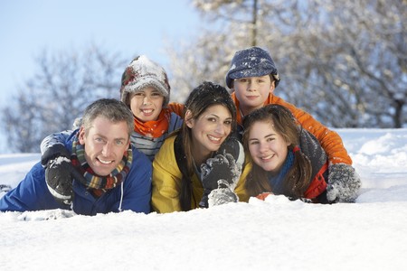 Young Family Having Fun In Snowy Landscapeの写真素材