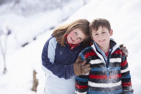 Portrait Of Two Children In Snowy Landscapeの写真素材