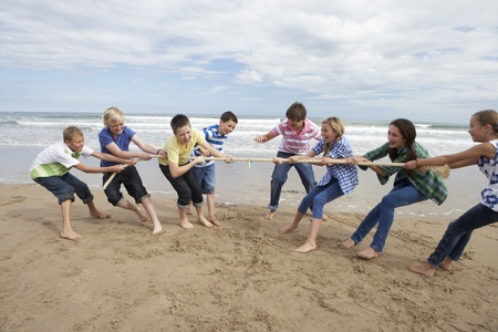 Teenagers playing tug of warの写真素材