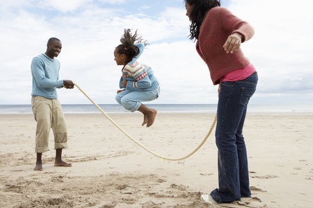 Family playing on beachの写真素材