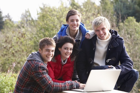 Students with laptop computerの写真素材