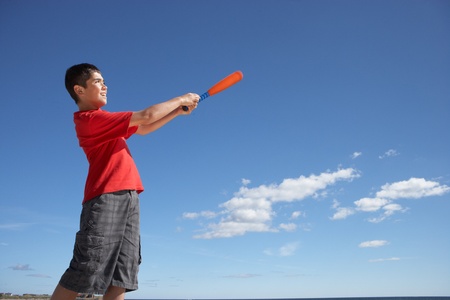 Teenage boy playing baseballの写真素材