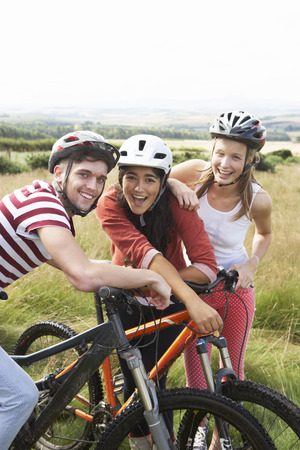 Group Of Young People Cycling In Countrysideの写真素材