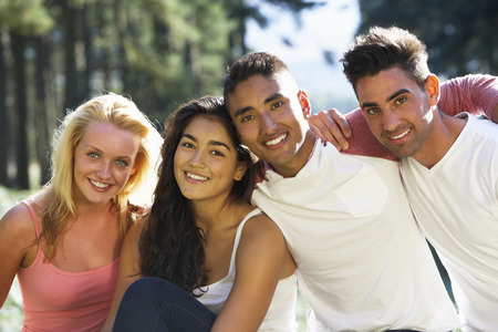 Group Of Young People Relaxing In Countrysideの写真素材