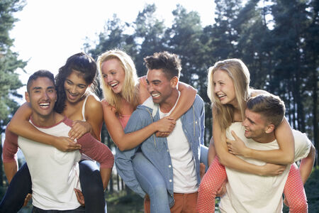 Group Of Young People Relaxing In Countrysideの写真素材