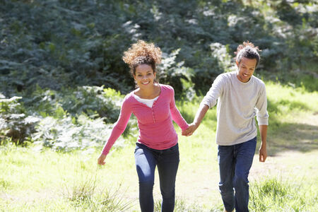 Romantic Young Couple Walking In Countrysideの写真素材