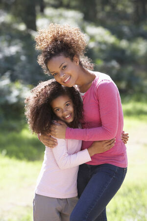 Portrait Of Mother With Daughter In Countrysideの写真素材