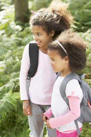 Two Girls Exploring Woods Togetherの写真素材