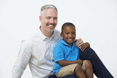 Studio Portrait Of Male Pre School Teacher With Pupilsの写真素材