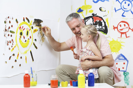 Teacher And Pupil In Pre School Art Classの写真素材
