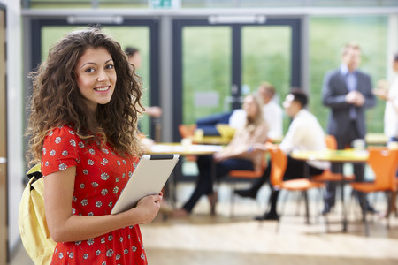 Portrait Of Female Student In Classroom With Digital Tabletの写真素材