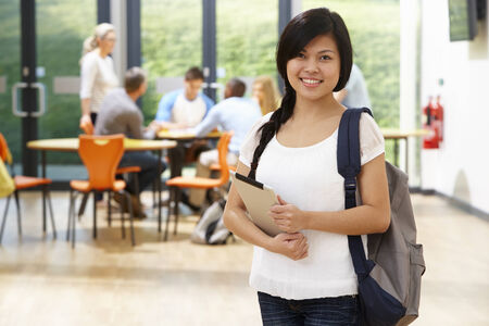 Portrait Of Female Student In Classroom With Digital Tabletの写真素材