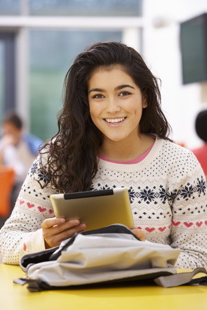 Female Teenage Student In Classroom With Digital Tabletの写真素材
