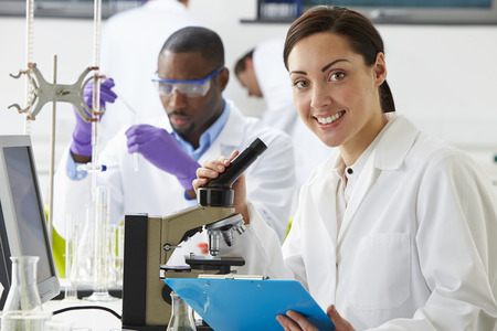 Technicians Carrying Out Research In Laboratoryの写真素材