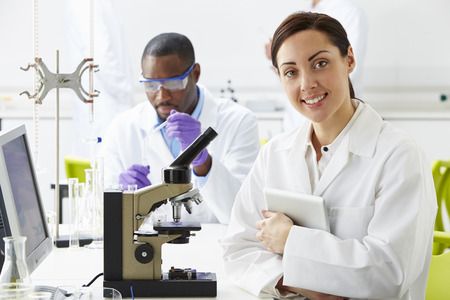Technicians Carrying Out Research In Laboratoryの写真素材