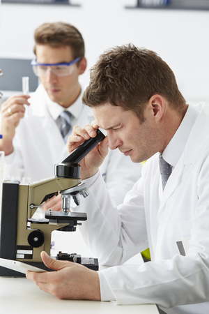 Technicians Carrying Out Research In Laboratoryの写真素材
