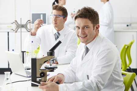 Technicians Carrying Out Research In Laboratoryの写真素材