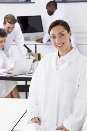 Portrait Of Technician In Laboratory With Colleaguesの写真素材