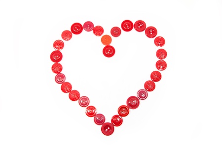Heart from red buttons on a white backgroundの写真素材