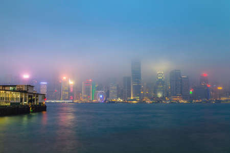 Hong Kong city skyline at pier over Victoria Harbor, Twilight sceneのeditorial素材
