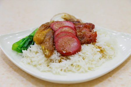 Barbecued red pork, streaky pork and boiled chicken in sauce with rice, Hongkong styleの写真素材