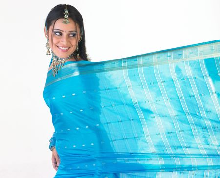 Beautiful hindu teenager dressd in a tradition blue silk sari