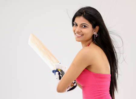 Young girl in a batting postureの写真素材