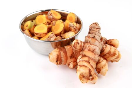 bowl of pieces of raw turmeric raw turmeric