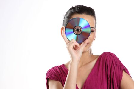 Portrait of the girl with a compact disk in hands.の写真素材