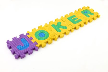 JOKER word arranged with puzzle letters