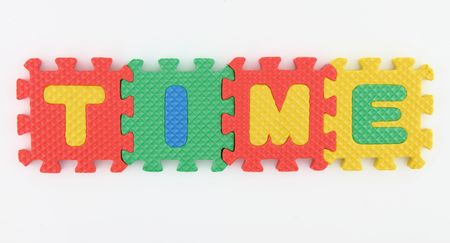 TIME word arranged in alphabet puzzleの写真素材