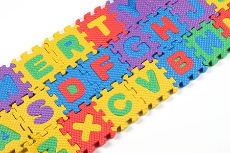 multi colored alphabet puzzle in keyboard orderの写真素材