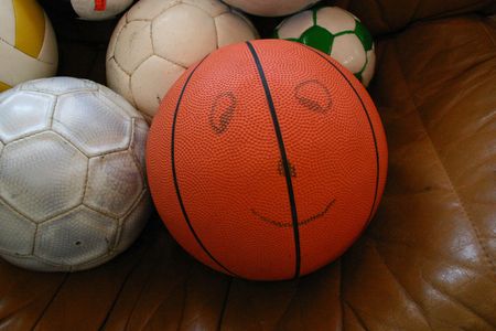 Smiling basketball with ballsの写真素材