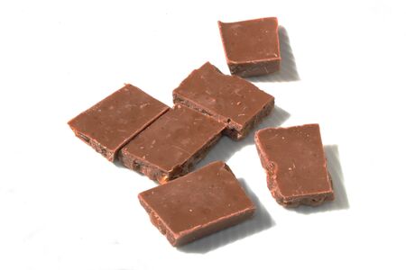 Isolated pieces of chocolate on white backgroundの写真素材