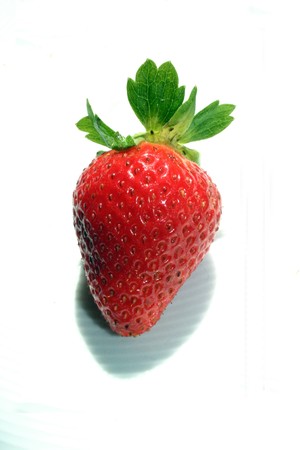Isolated red-green tasty strawberry on white backgroundの写真素材