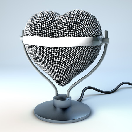 Studio desk microphone in heart shape, in front of light blue, gray background,  3d renderingの写真素材