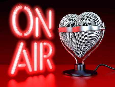 Heart shaped microphones on reflecting, red surface in front of, lateral  to neon sign, letters \\\"On Air\\\", 3d renderingの写真素材